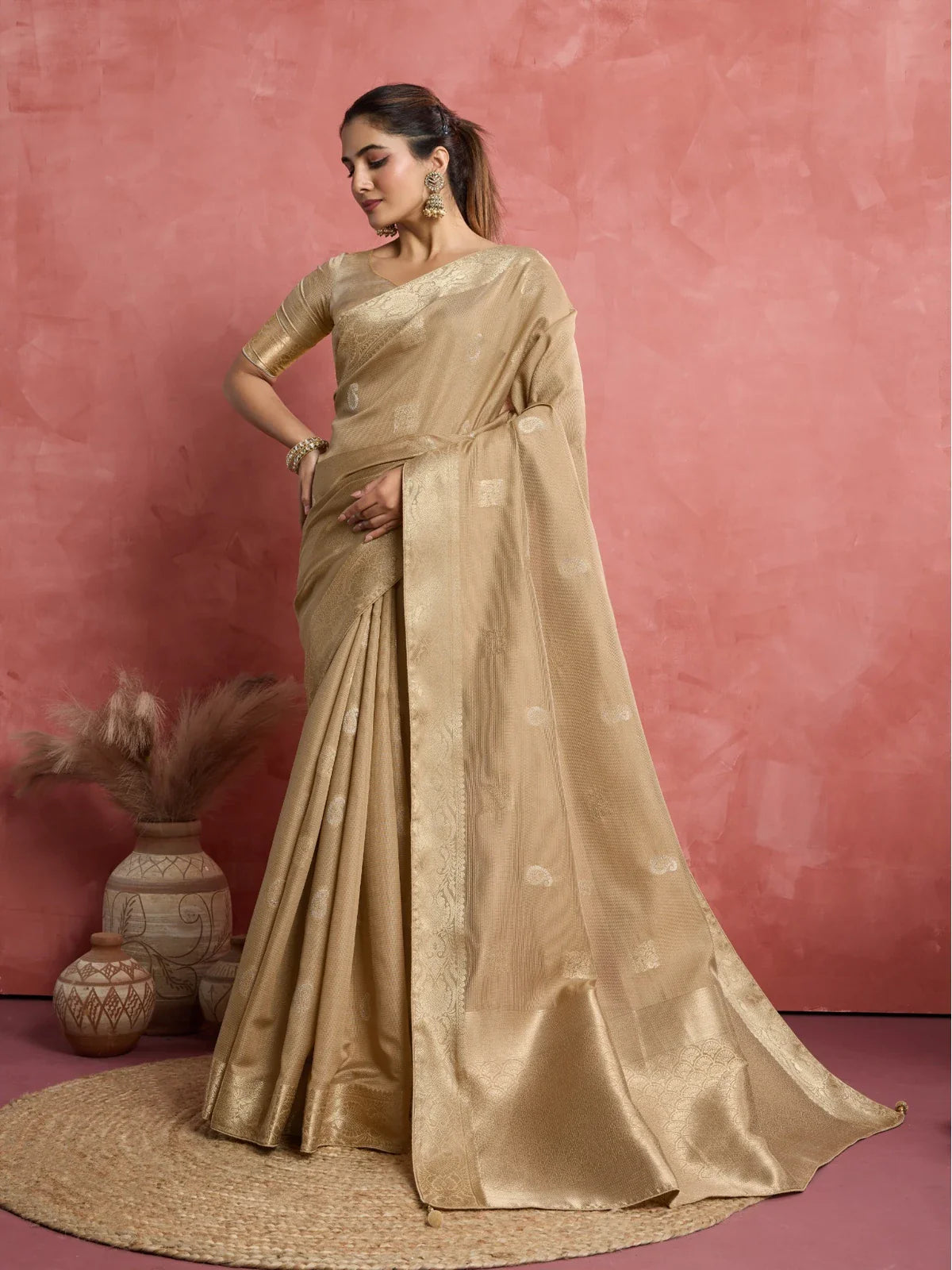 Tarani golden silk saree front pose highlighting woven butta and graceful drape
