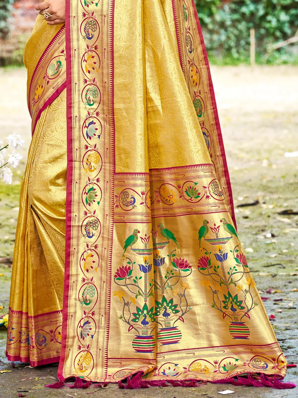 Tarani golden Kanjivaram silk saree pallu view with traditional woven motifs