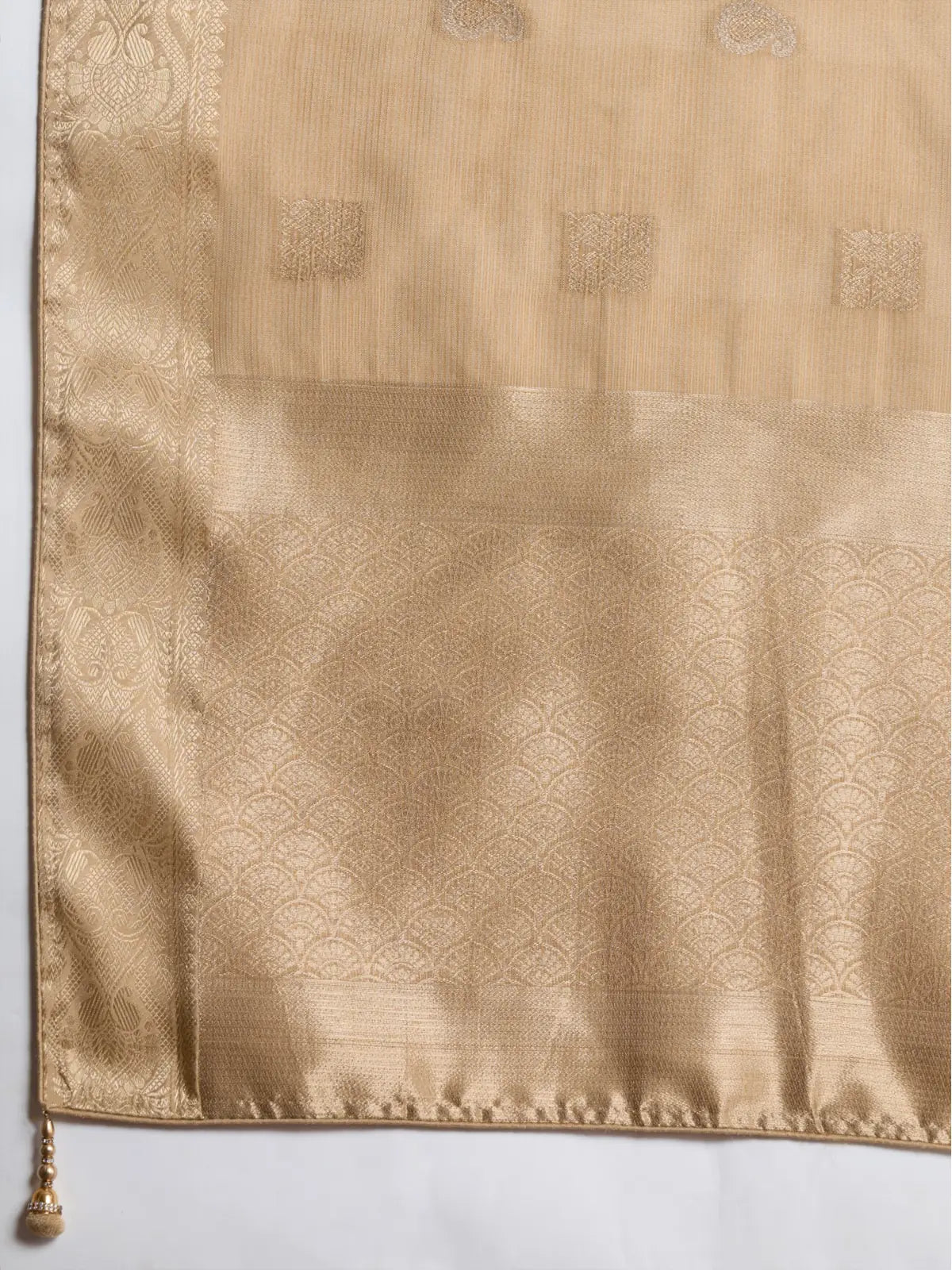 Tarani golden silk saree pallu closeup highlighting rich woven patta