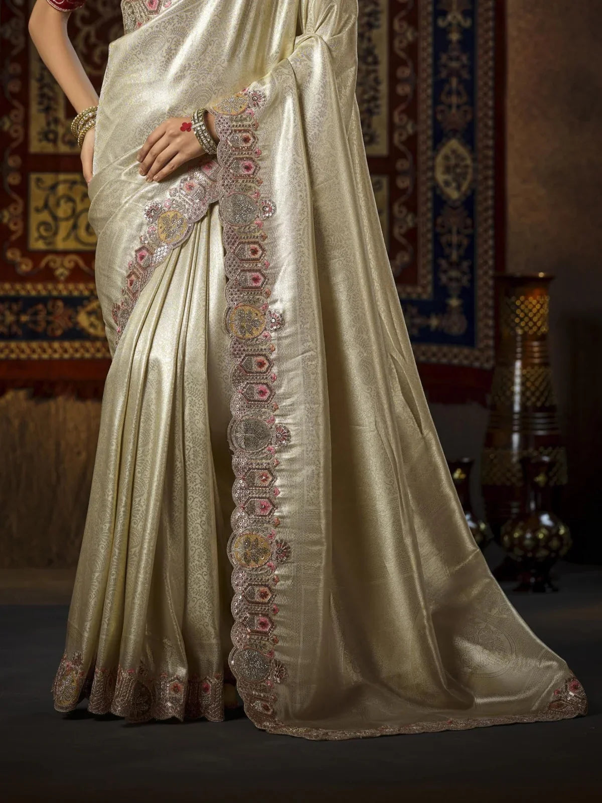 Tarani golden silk saree pallu view highlighting border embroidery and handwork design