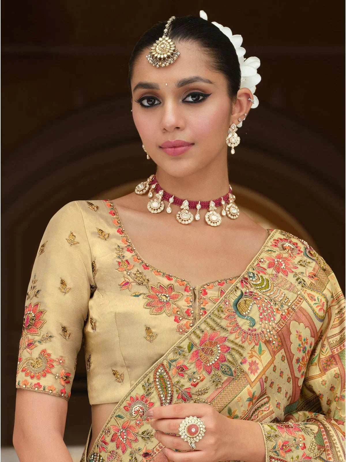 Tarani designer golden silk saree blouse close-up with embroidery details