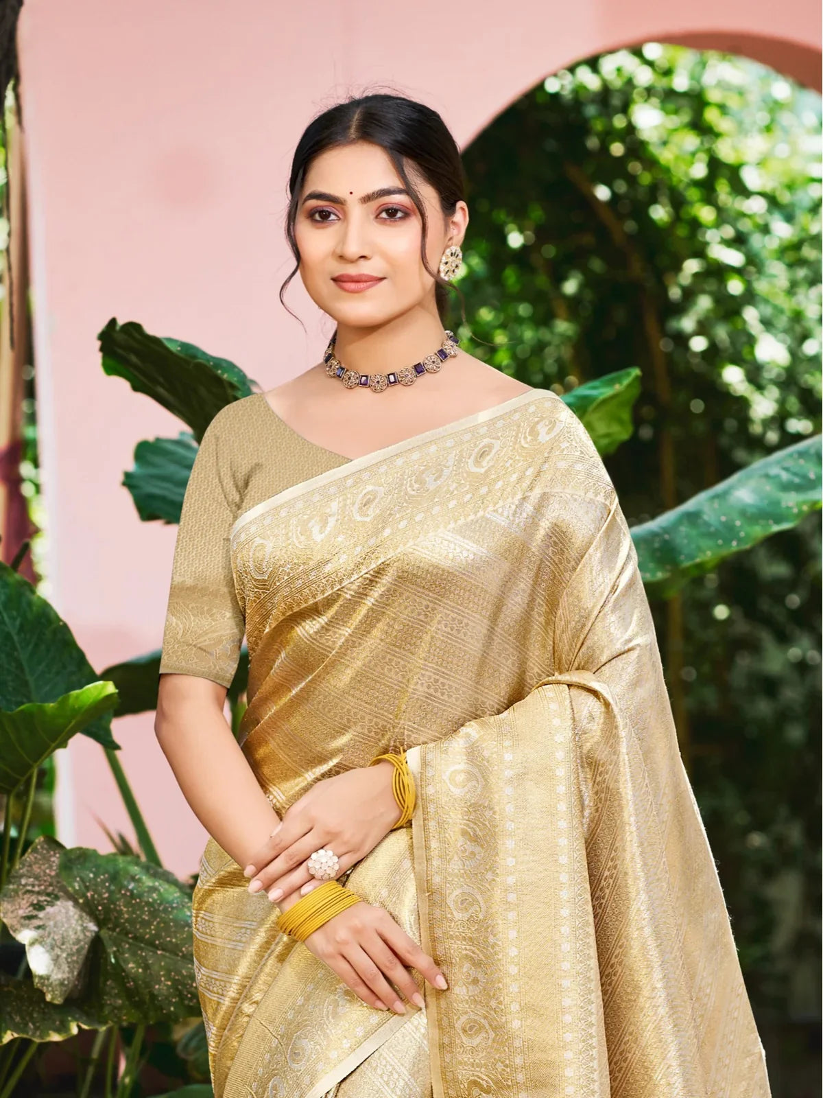 Tarani golden Kanjivaram silk saree upper body view showing elegant drape and blouse