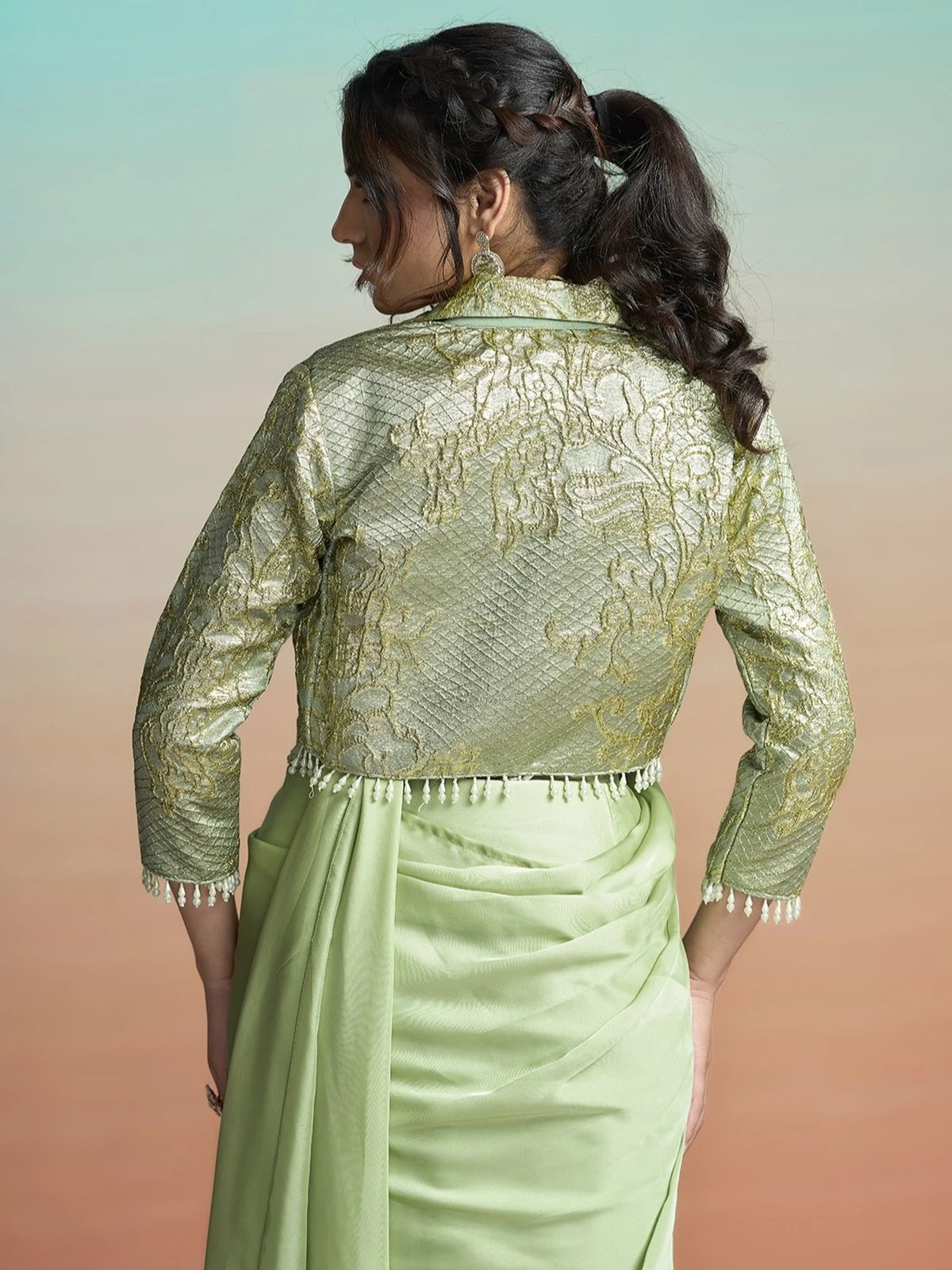 Tarani Padmika green satin silk saree back view with jacquard jacket and pearl trim