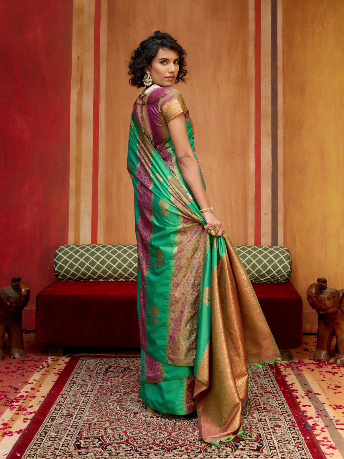 Tarani green silk saree back view showcasing fall and pleats