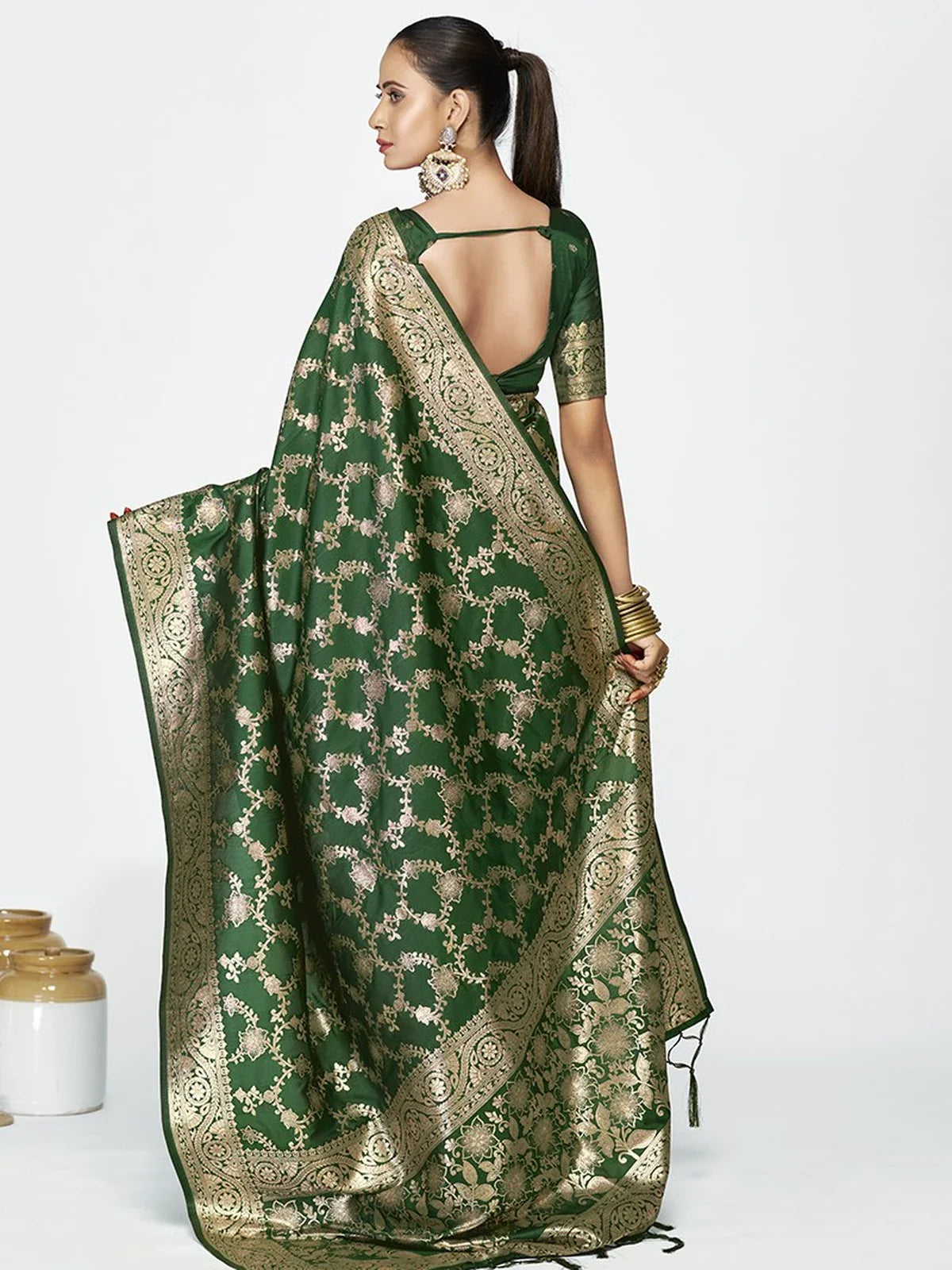 Tarani green silk saree shown from the back highlighting pallu and blouse design
