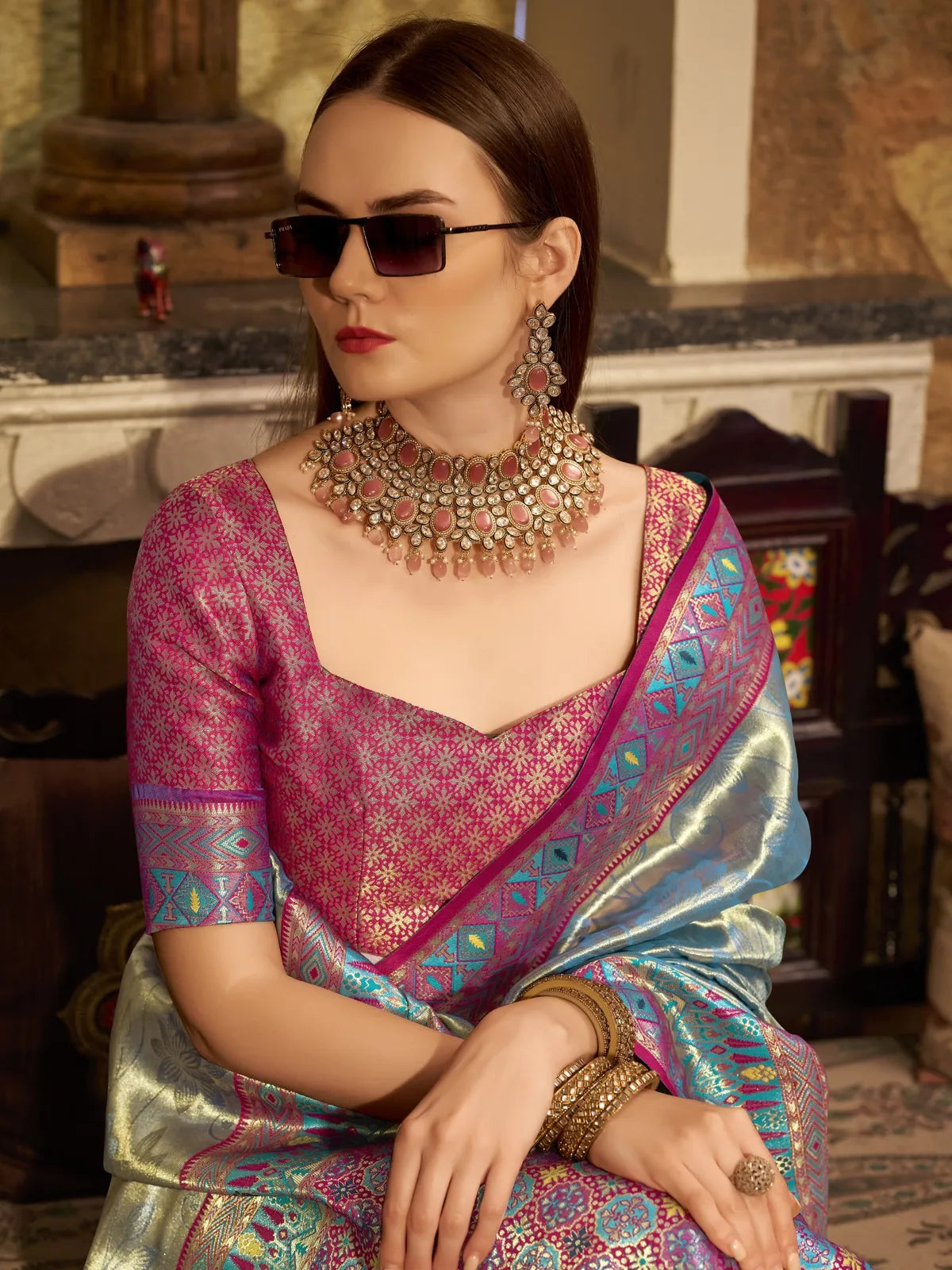 Tarani green tissue silk saree blouse view showing contrast blouse with intricate detailing