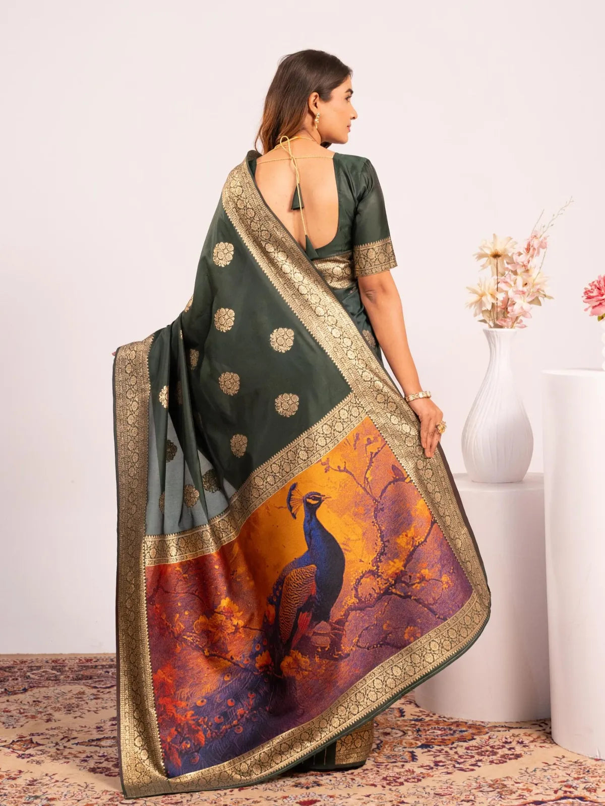 Tarani banarasi saree back view with elegant deep-cut blouse and zari border detailing