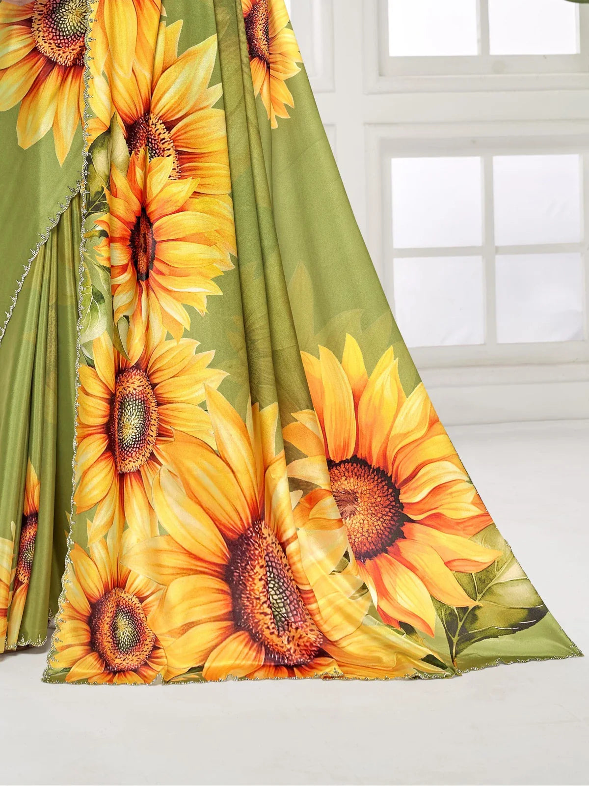 Tarani premium sunflower saree fabric closeup with bright floral detailing and border work