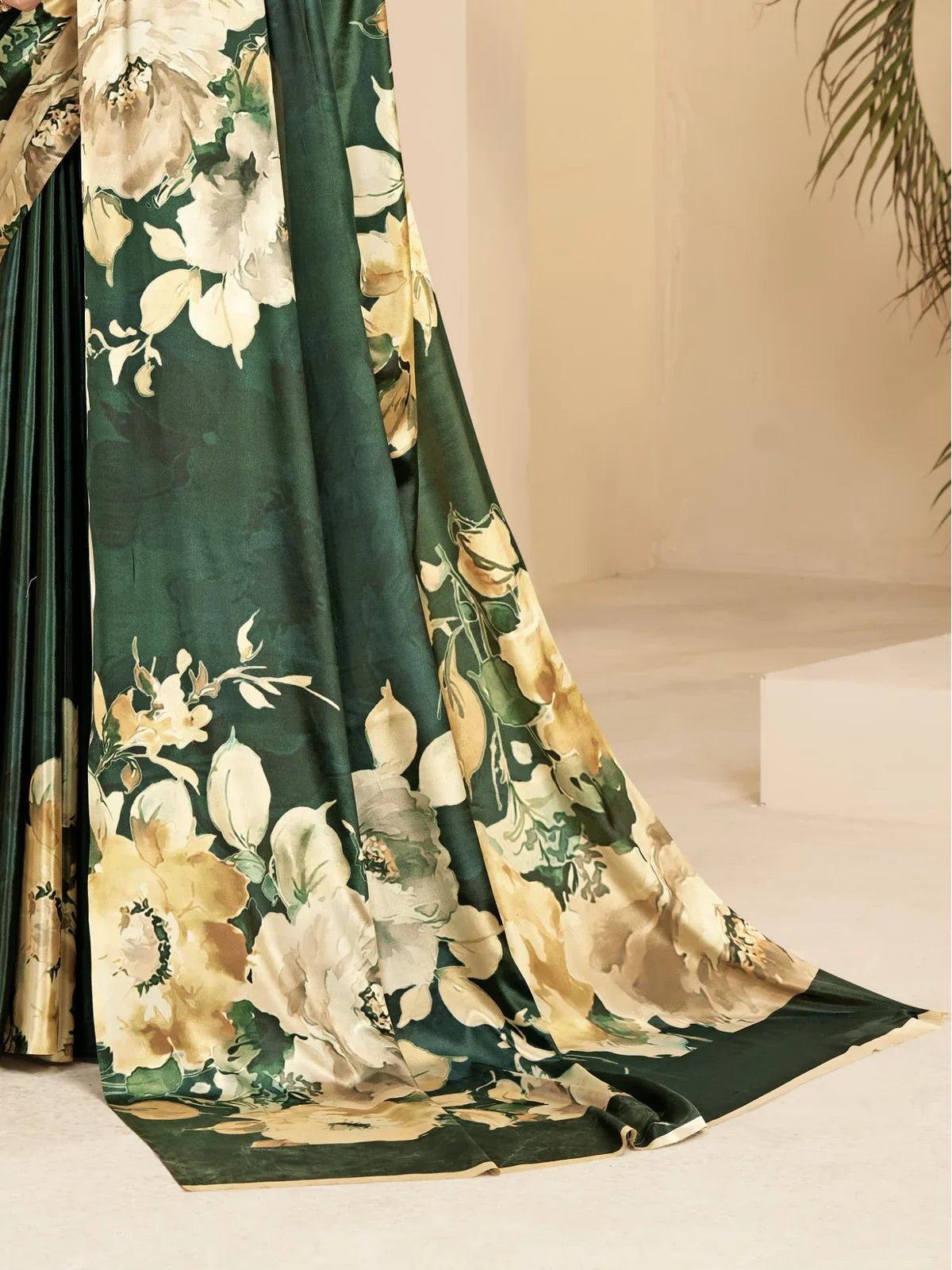 Tarani close-up view of green floral malai crape silk saree fabric with soft detailing