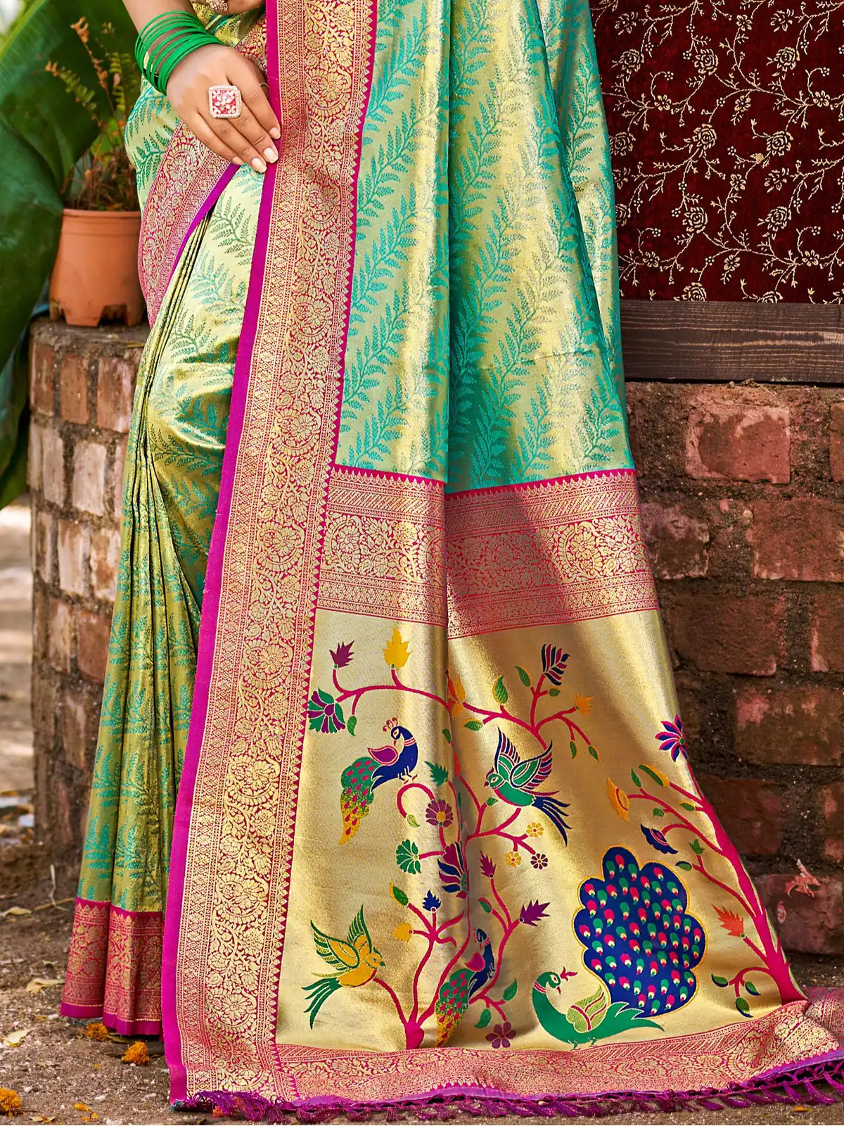 Tarani closeup of Kanjivaram silk saree showing zari detailing and woven leaf motifs