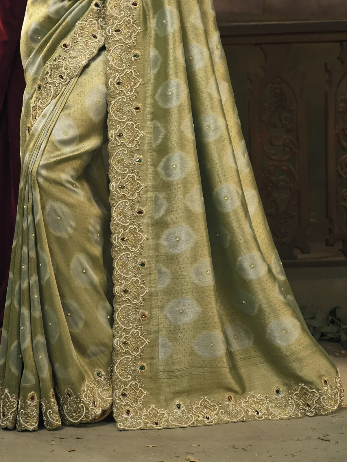 Tarani detailed border embroidery and emerald heavy work on soft green zarif silk party saree
