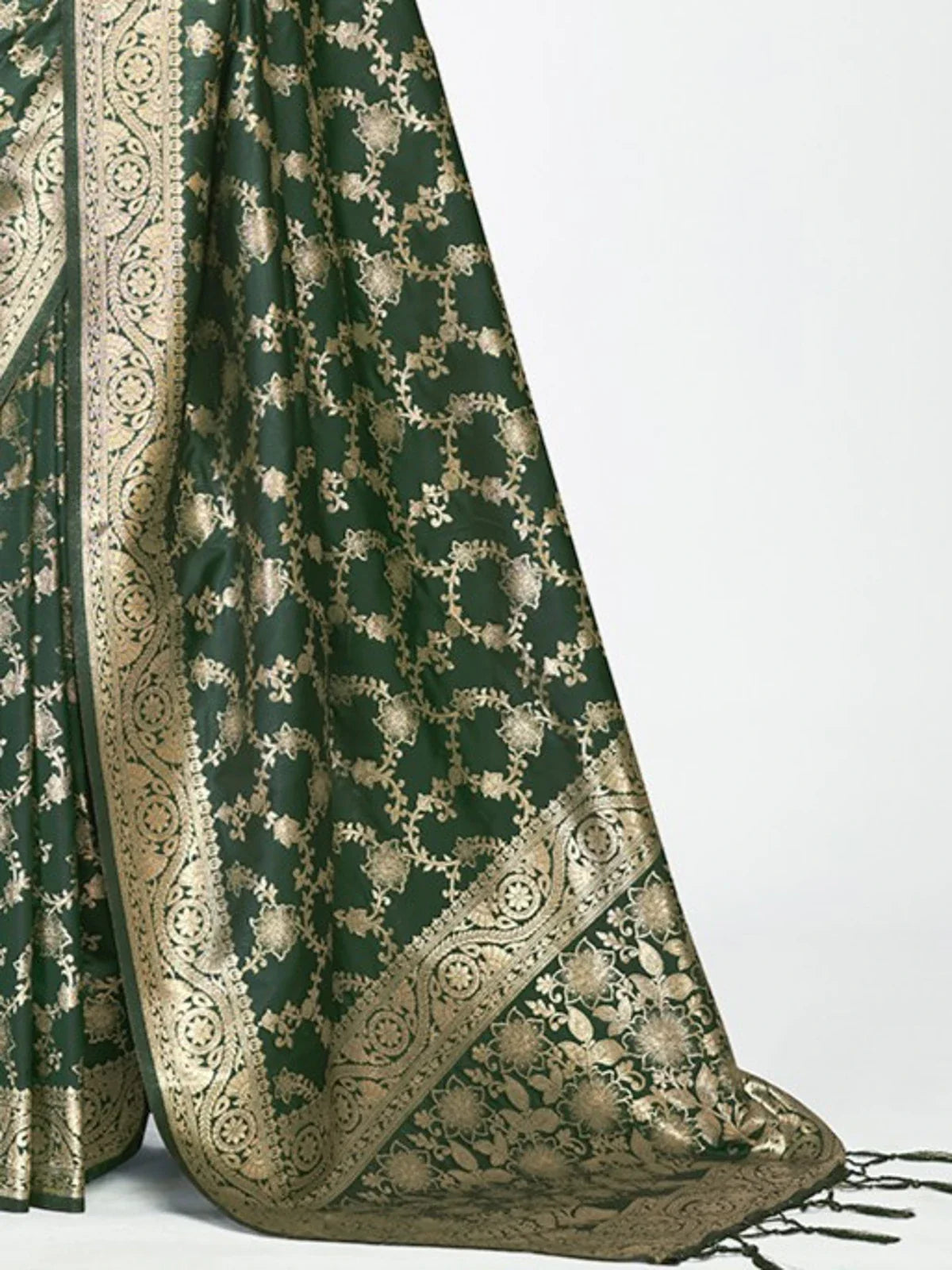 Tarani closeup view of rich green silk saree with traditional golden motifs