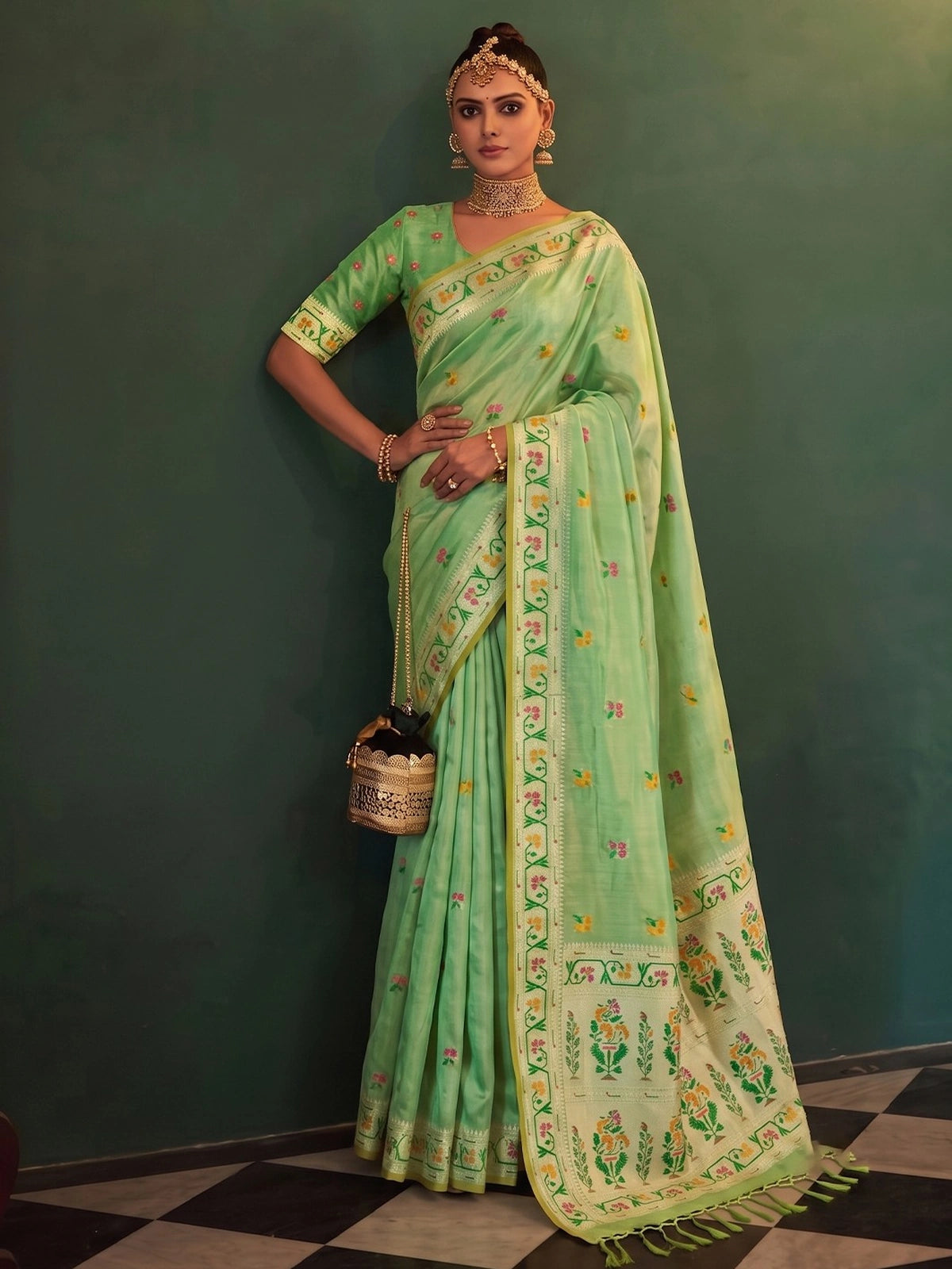 Tarani Kamalika green tissue silk saree with woven floral border and designer pallu front view
