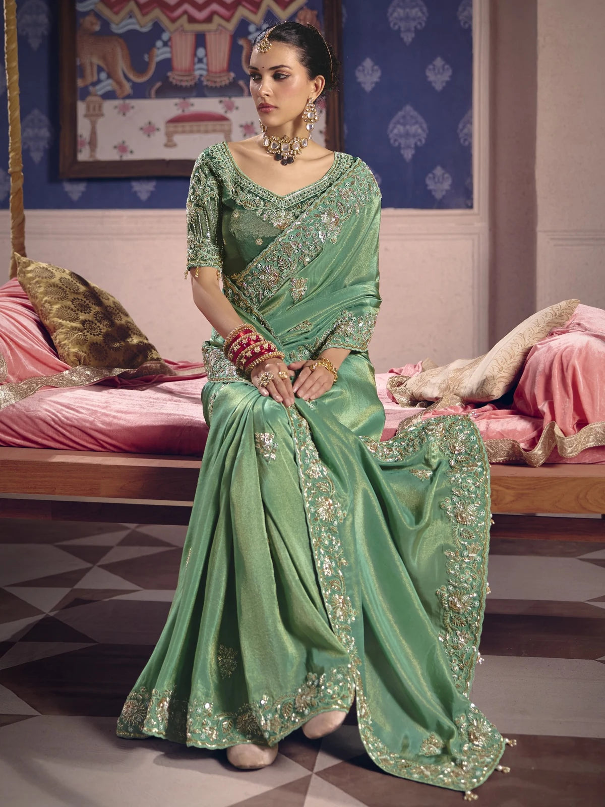 Tarani Ujwalika green party wear saree front pose with heavy embroidery and elegant drape