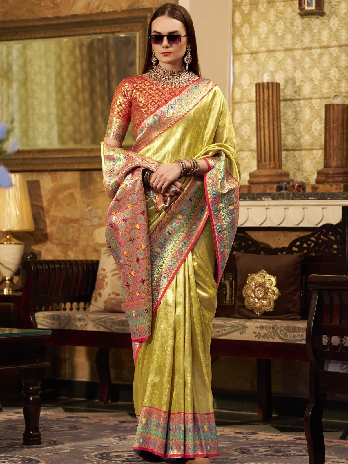 Tarani front view of green tissue silk saree with contrast blouse