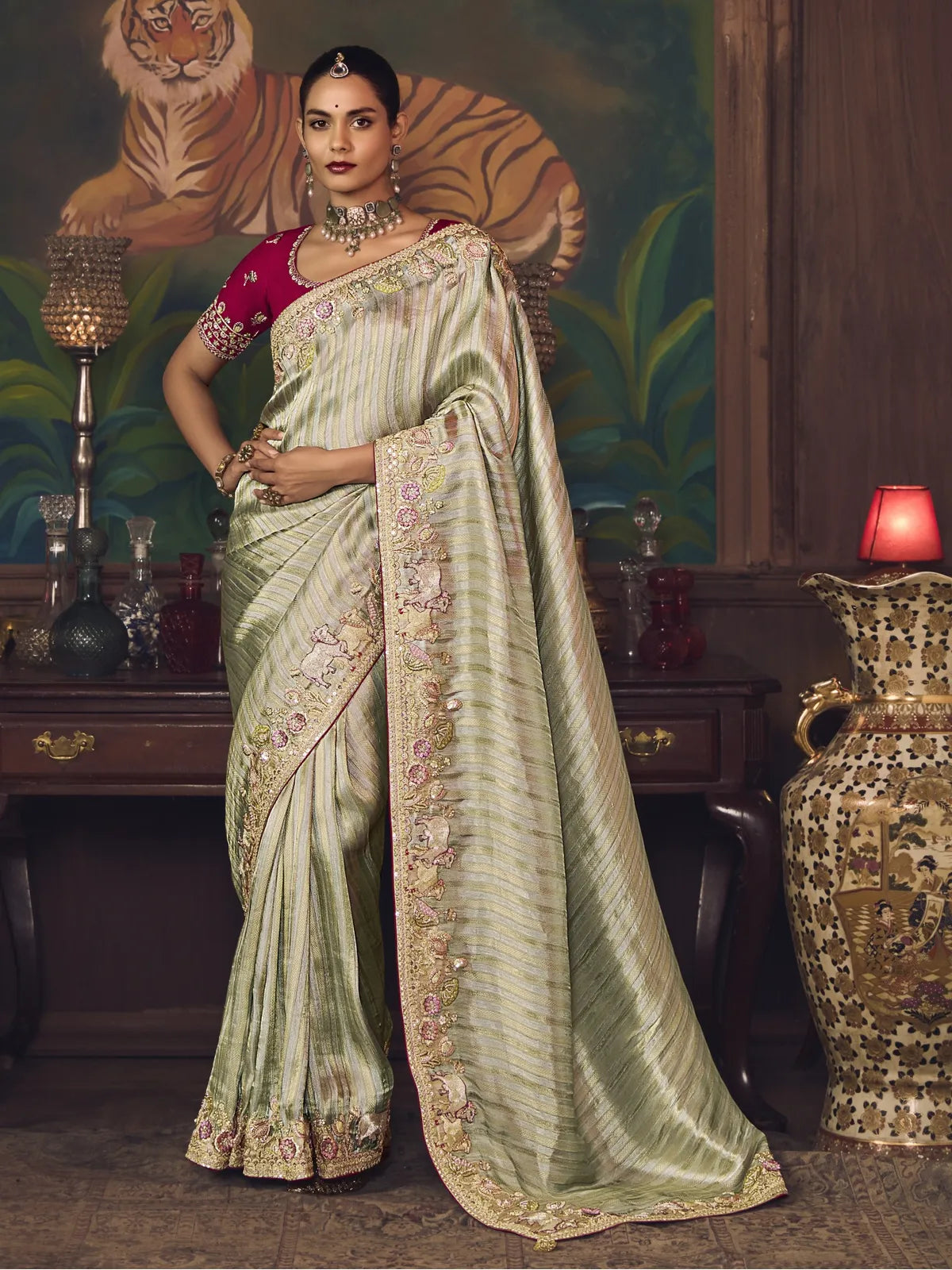 Tarani green silk saree with elephant embroidery and maroon blouse in full view