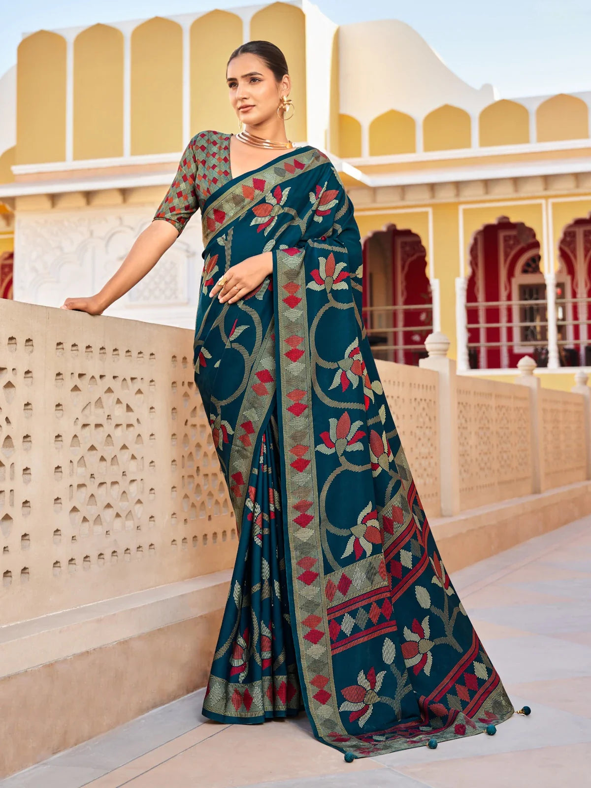 Tarani green silk saree with red and olive floral weave and traditional blouse for festive occasions