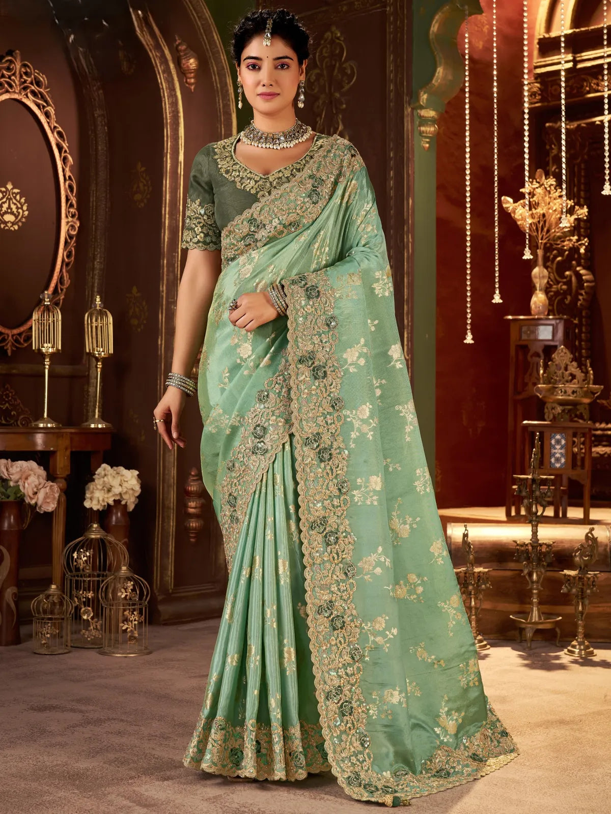 Tarani green silk saree full view with heavy zari border and embroidered blouse