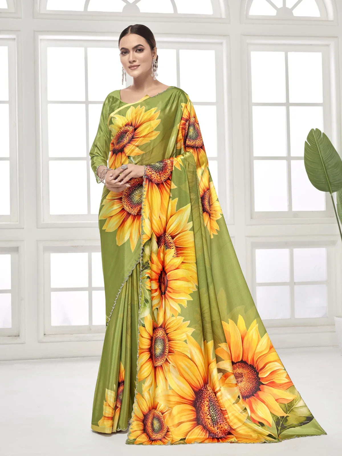 Tarani green silk crape saree with bold sunflower print and Swarovski work shown in full view