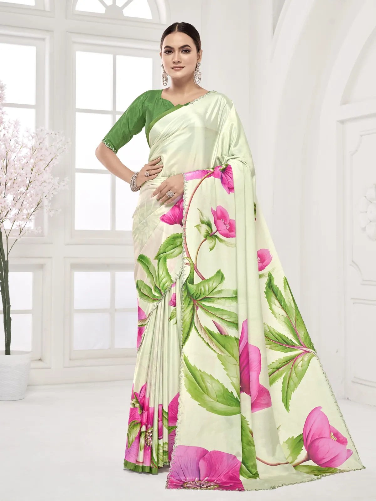 Tarani green silk saree with bold floral prints and Swarovski border in full view