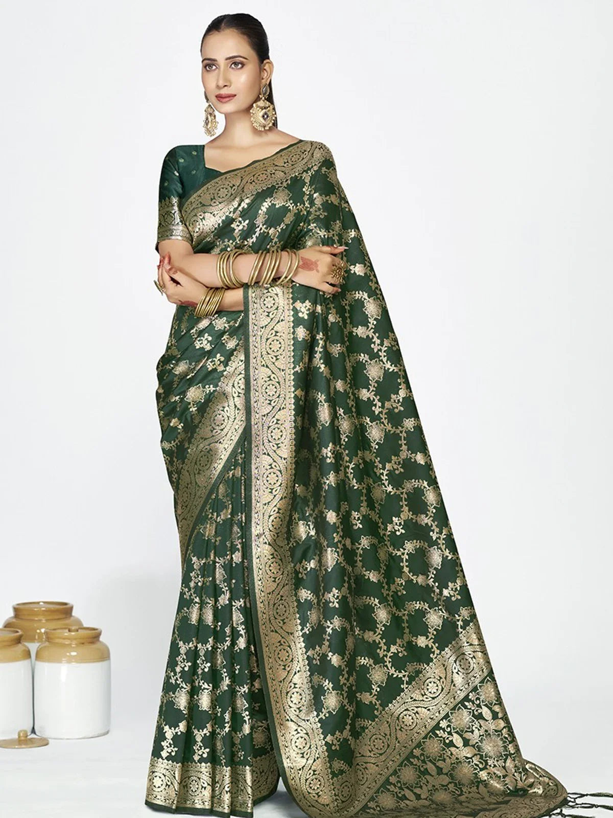 Tarani green silk saree with golden weaving and matching blouse for party and festive wear
