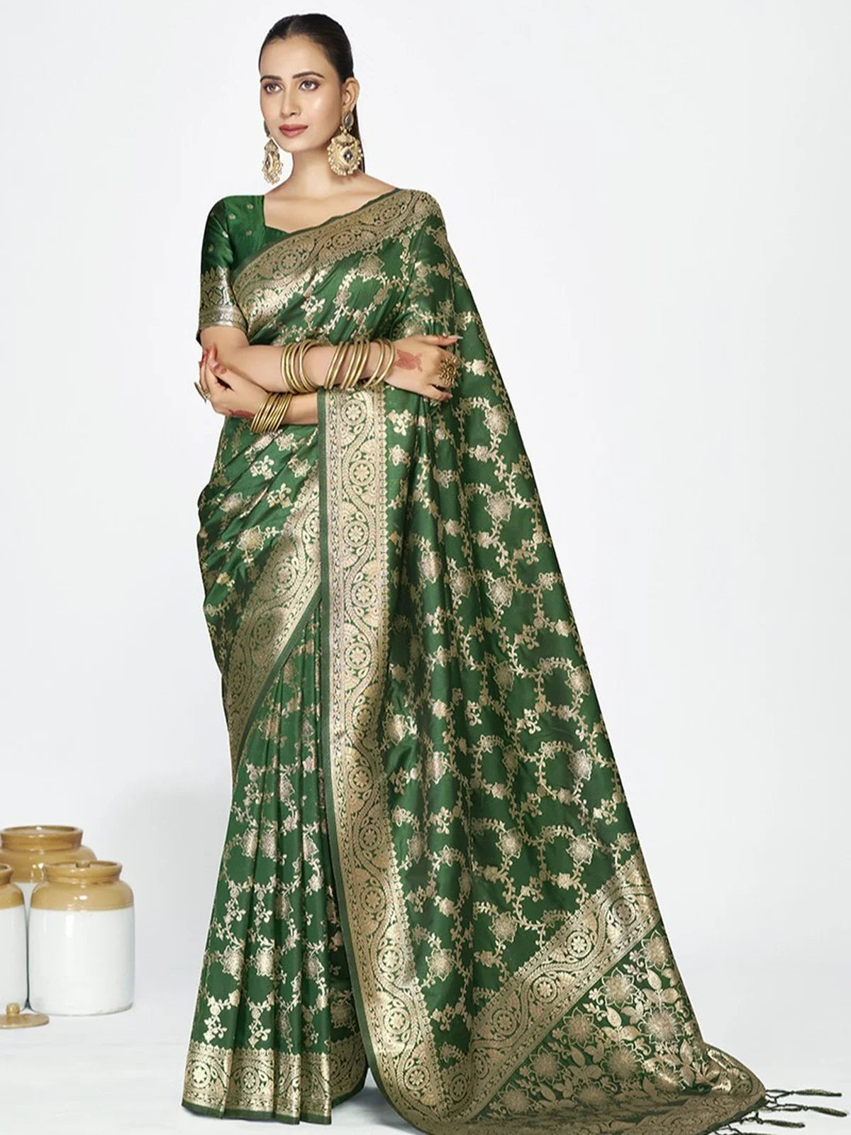 Tarani green silk saree with golden border and all-over weaving shown in full-view