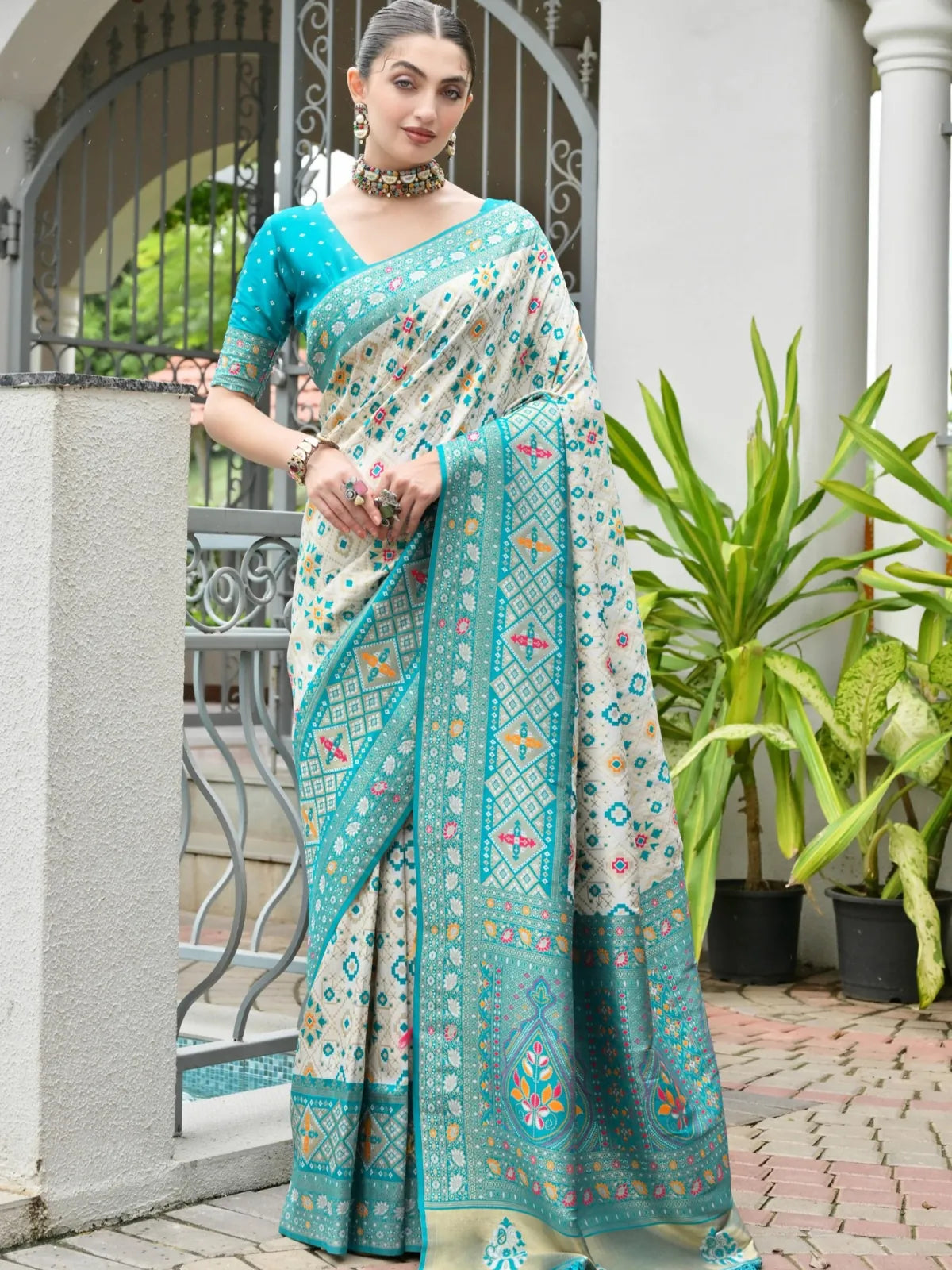 Tarani festive green banarasi patola silk saree with rich zari pallu and full drape view