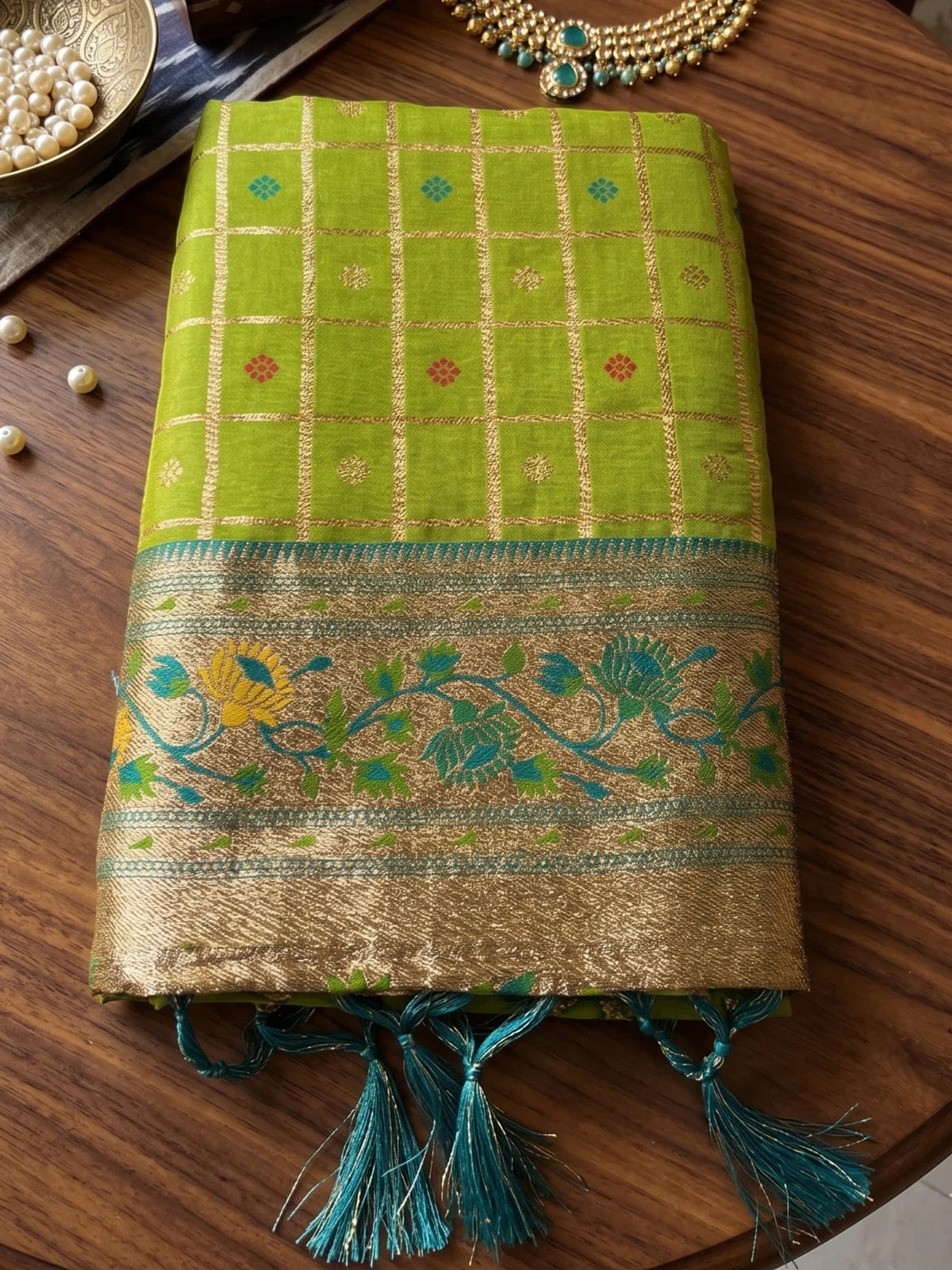 Tarani Arunika green Banarasi silk saree pallu and floral zari border close view