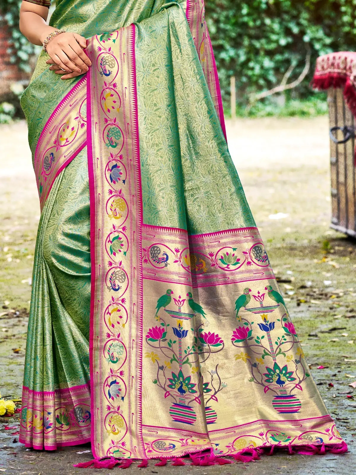 Tarani green Kanjivaram silk saree pallu view with traditional woven border motifs