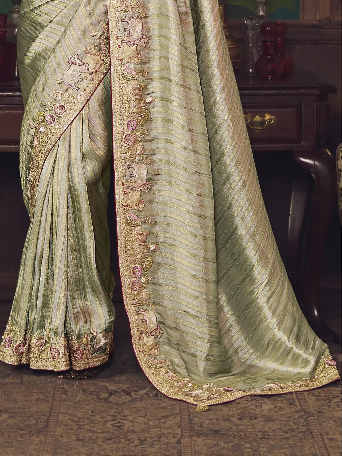 Tarani silk saree with heavy embroidery pallu and elephant motifs in close-up