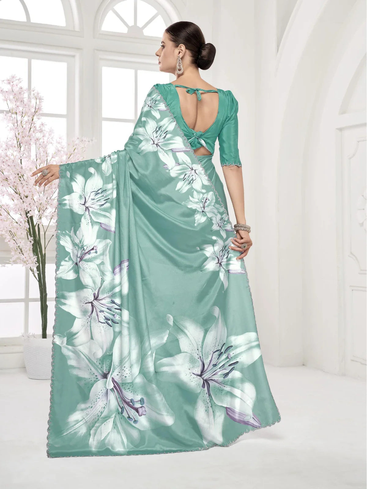Tarani floral green silk saree with Swarovski border pallu and digital print design