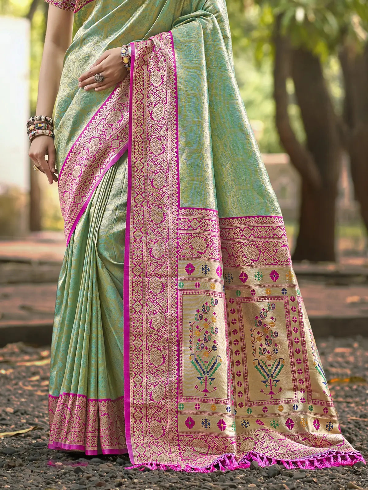 Tarani green silk saree with intricate woven floral pallu design