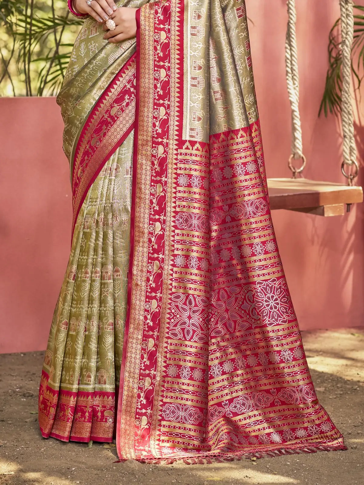 Tarani green kanjivaram silk saree pallu closeup with intricate red woven design