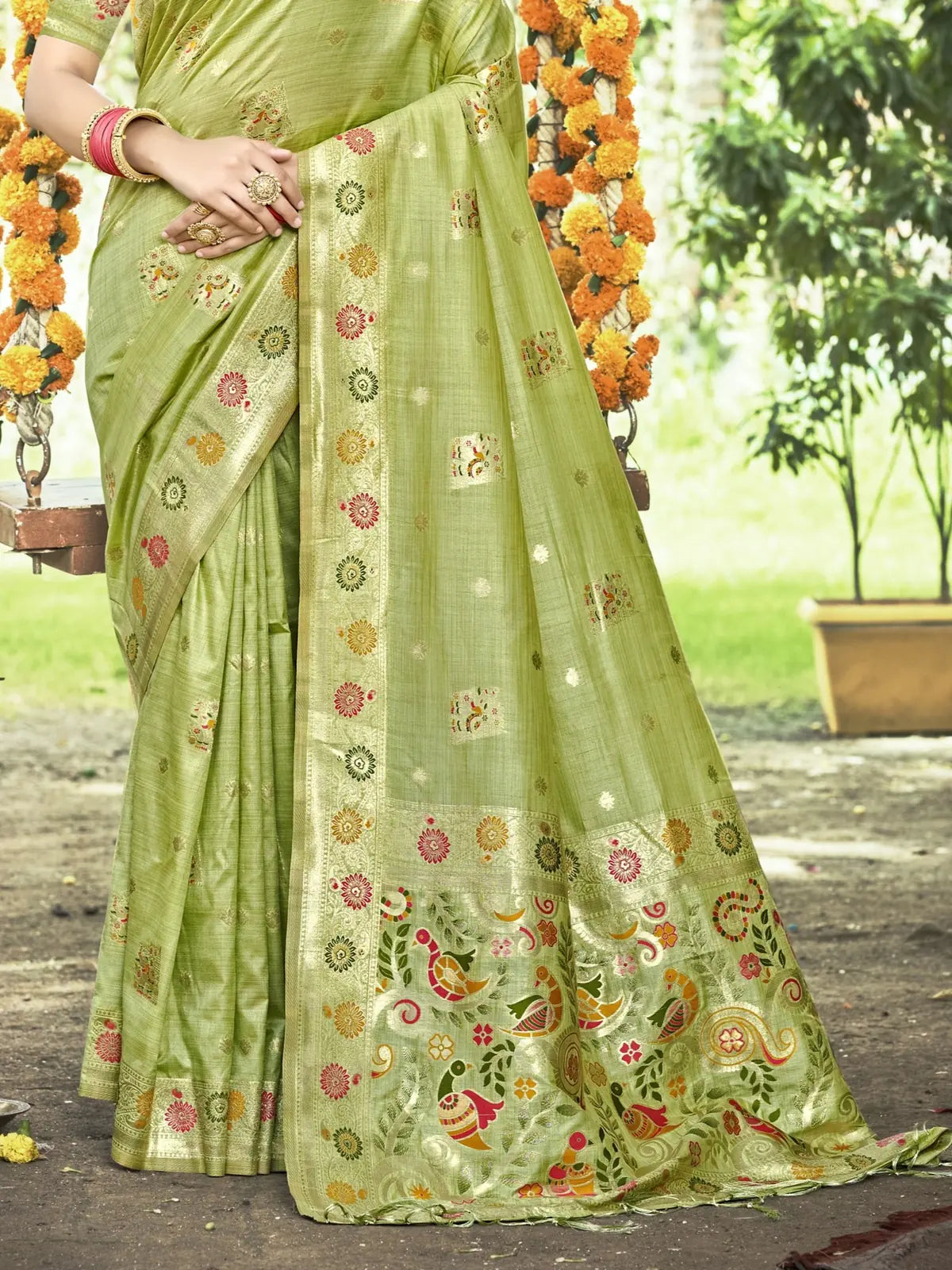 Tarani green Kanan silk saree pallu view showing woven floral border and motifs