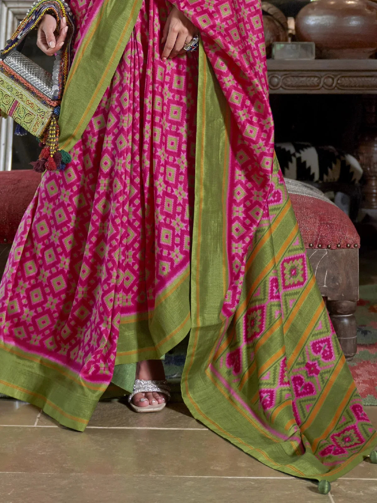 Tarani green silk saree pallu border with intricate ikkat design and contrast pattern