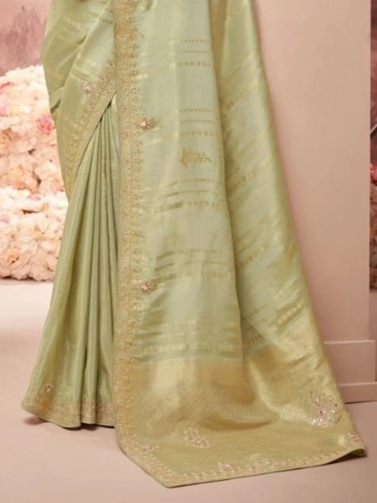 Tarani green silk saree pallu with handwoven border and delicate embellishments