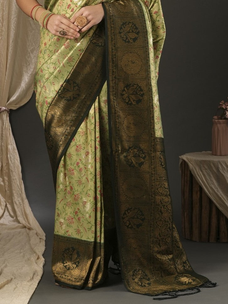 Tarani elegant green silk saree with rich golden pallu and intricate weaving