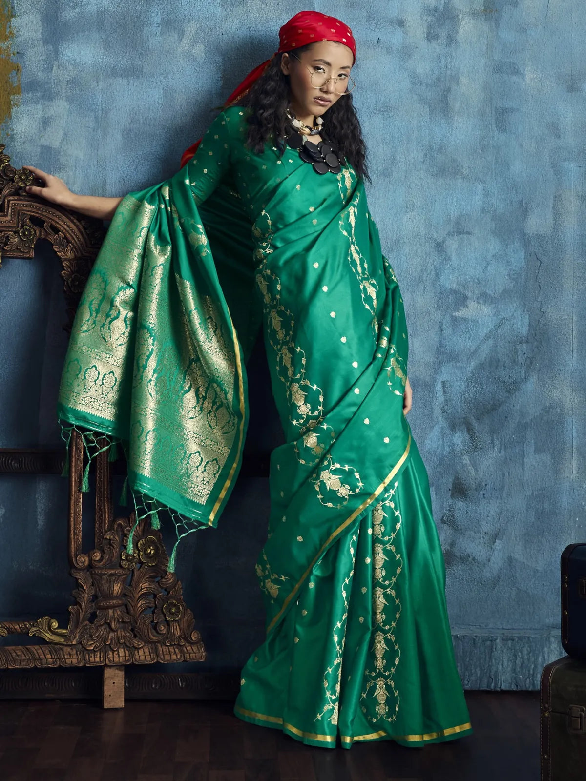 Tarani Rekha green satin silk saree side view with elegant woven pallu and zari border