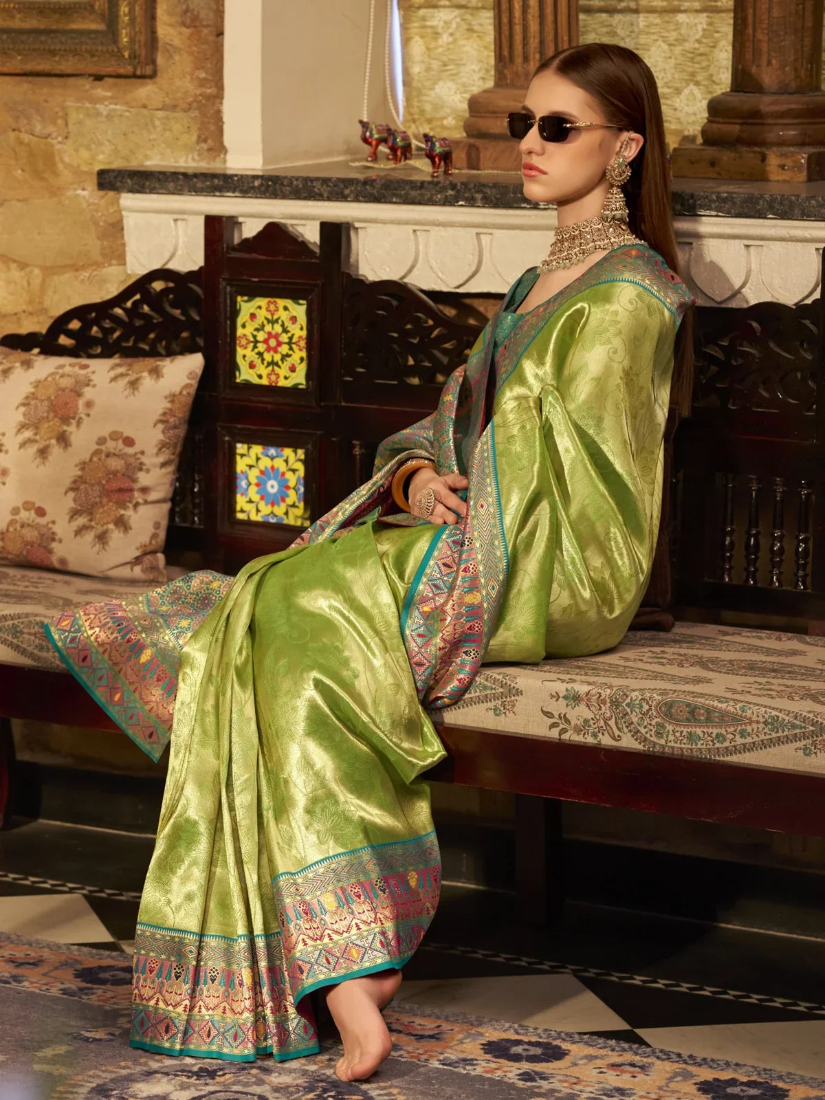 Tarani green silk saree side view with elegant woven detailing and contrast pallu