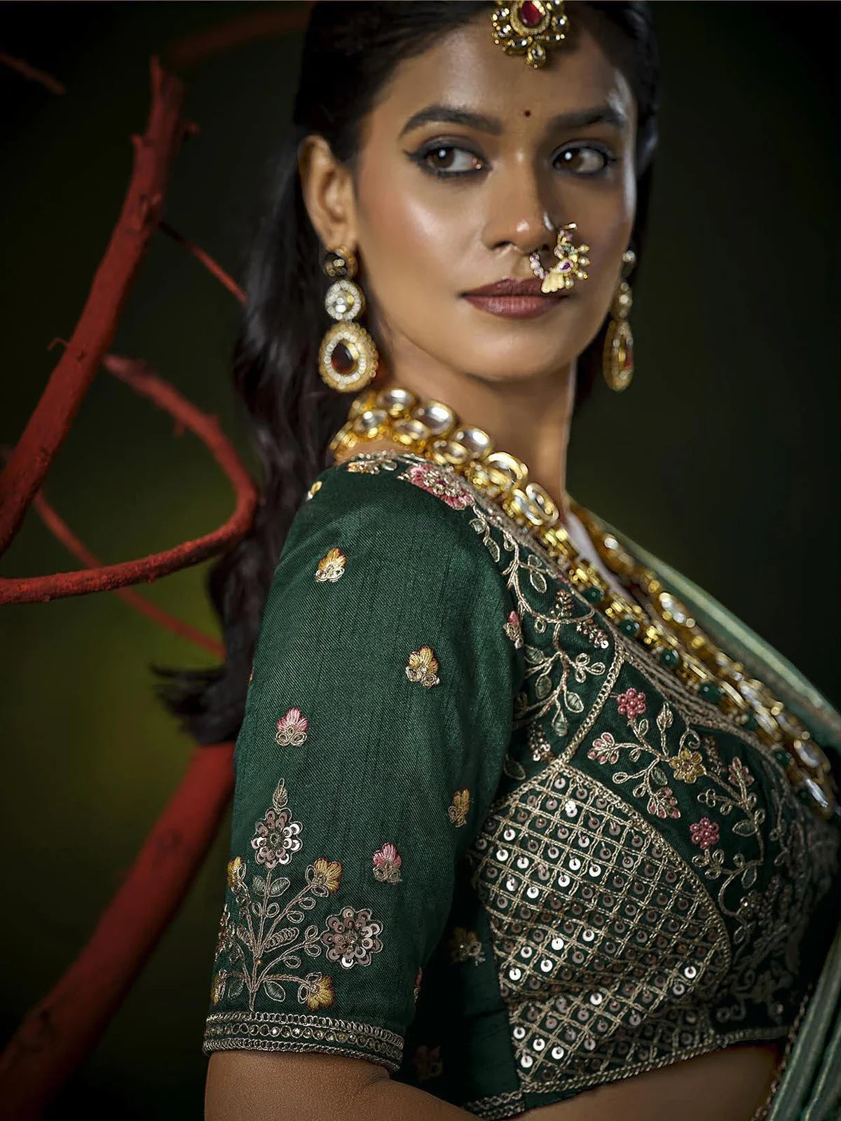 Tarani side pose Chandani showcasing sleeve embroidery and glossy silk drape festive wedding wear