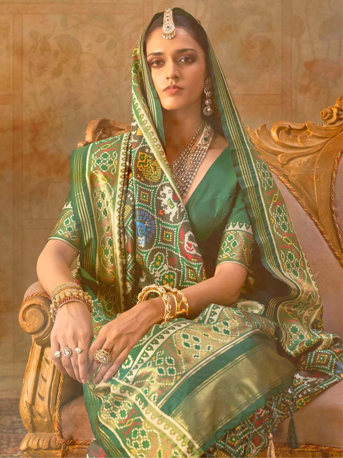 Tarani green Patola weaving silk saree upper body view showing blouse and border