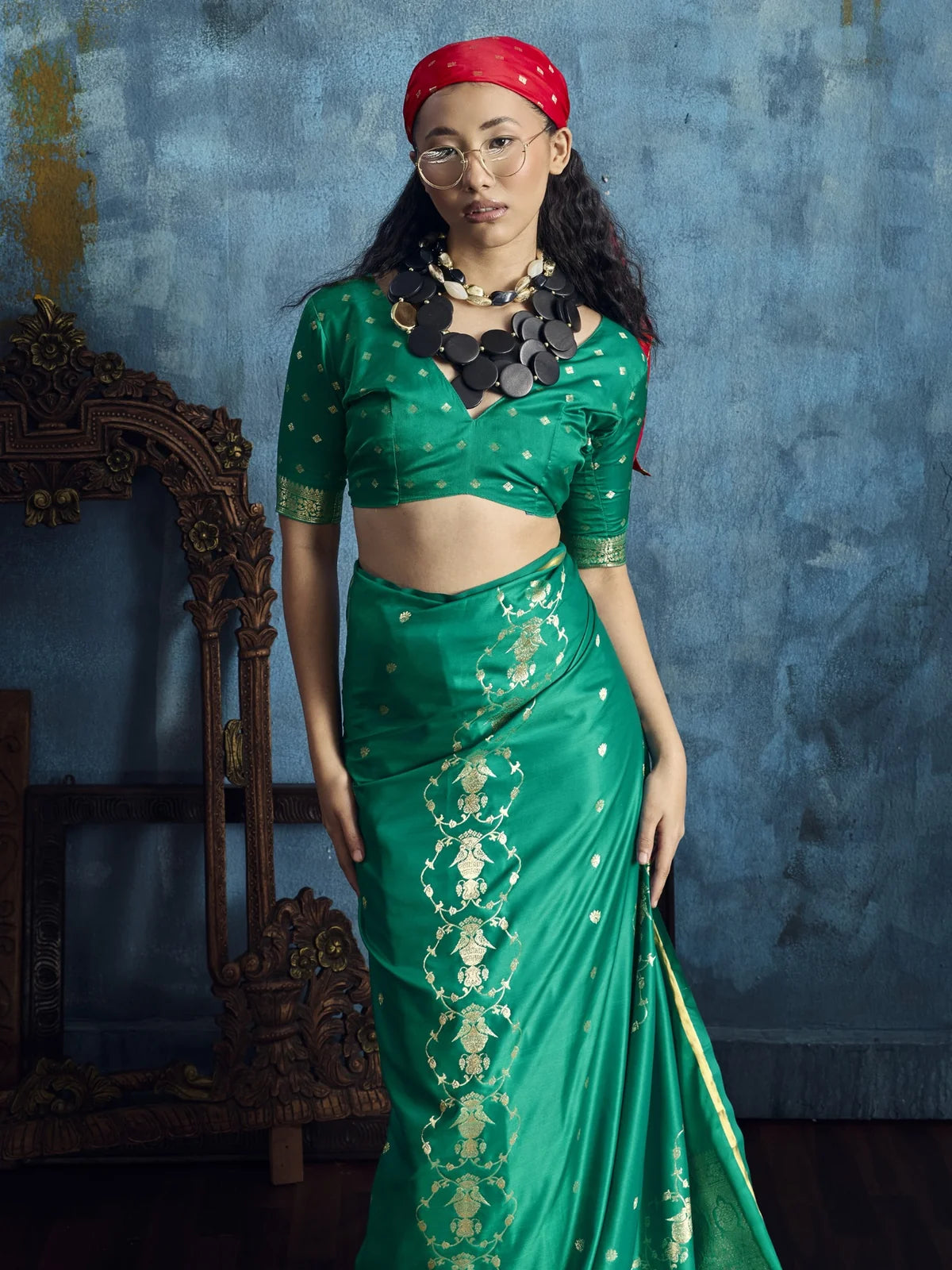 Tarani Rekha green satin handloom saree upper body view showing brocade blouse and woven motifs