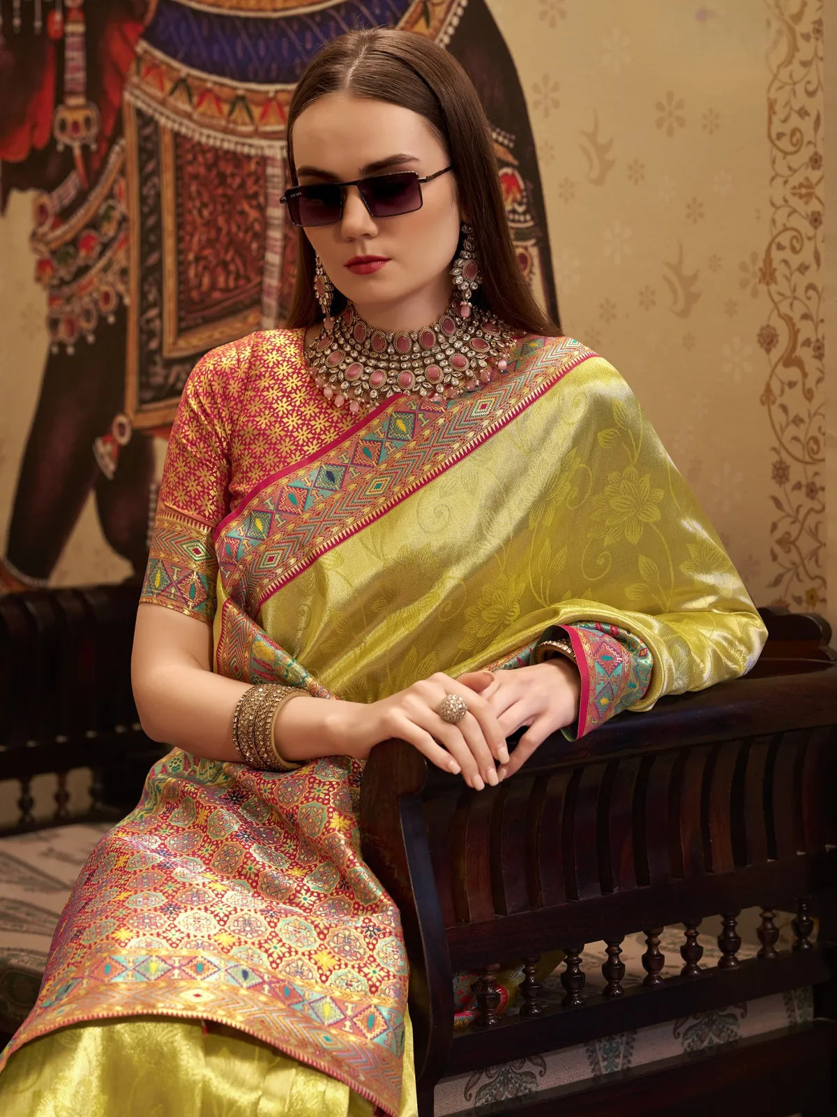 Tarani upper body view of green tissue silk saree styled for festive occasions