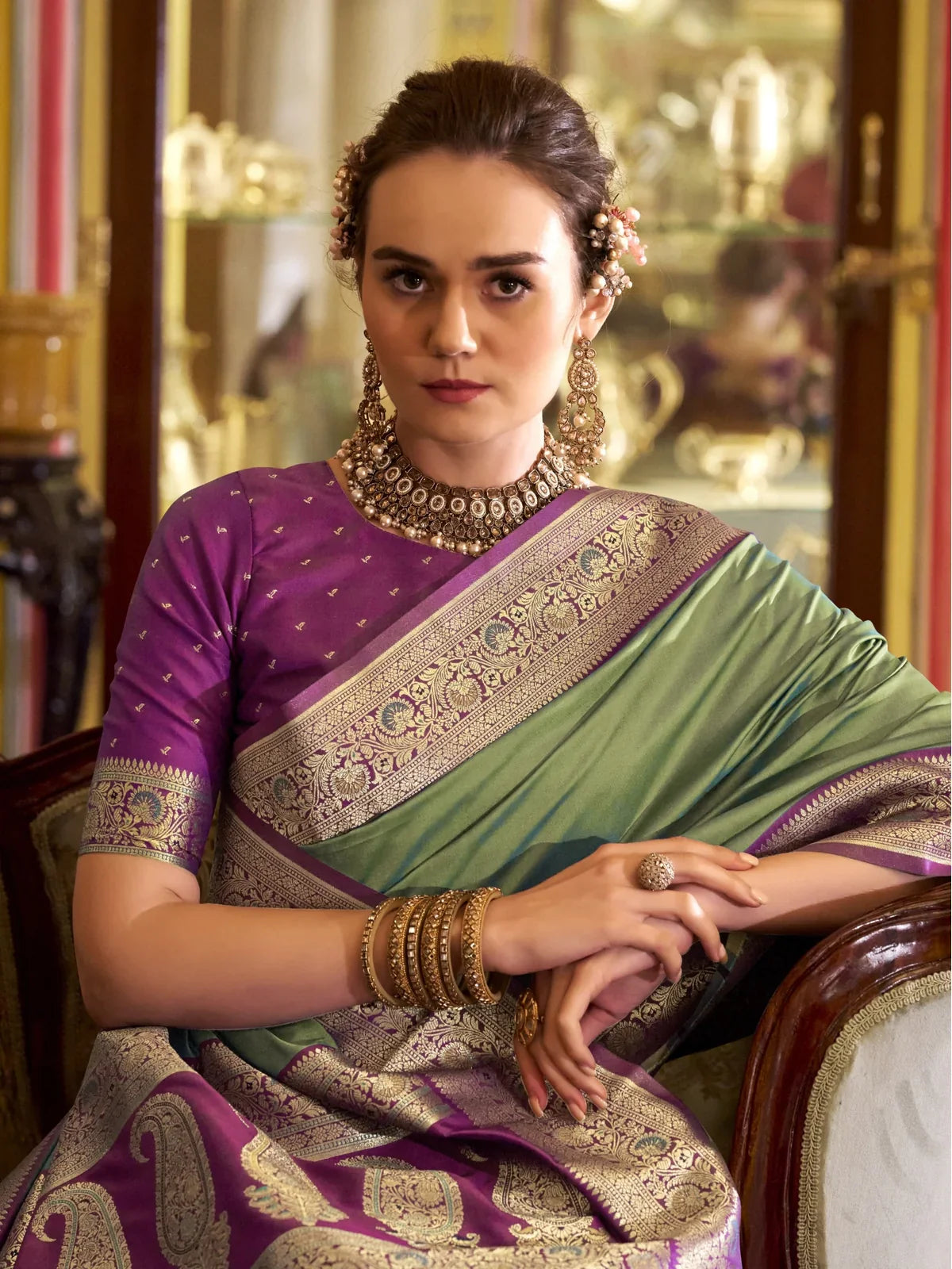 Tarani green silk saree upper body view showing purple blouse and rich border