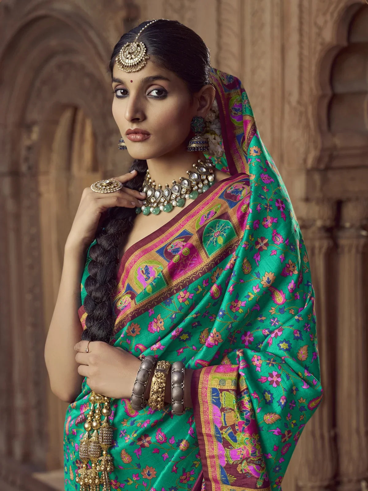 Tarani elegant green silk saree upper body view showing blouse and jewellery