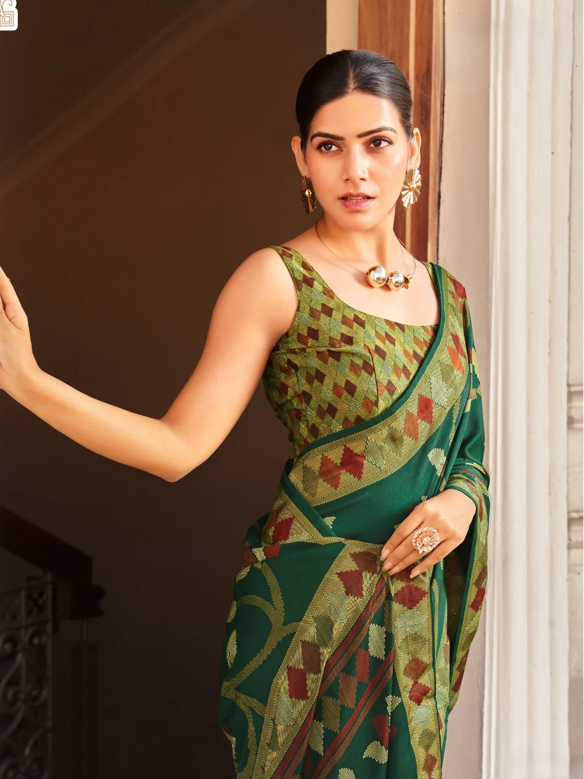 Tarani designer green silk saree upper body closeup with triangle woven blouse and elegant styling