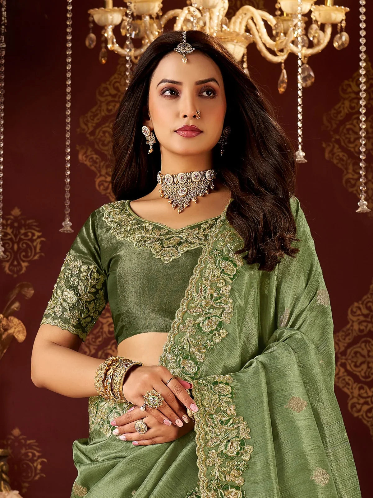 Tarani elegant green saree upper body with rich blouse and embroidered neckline design