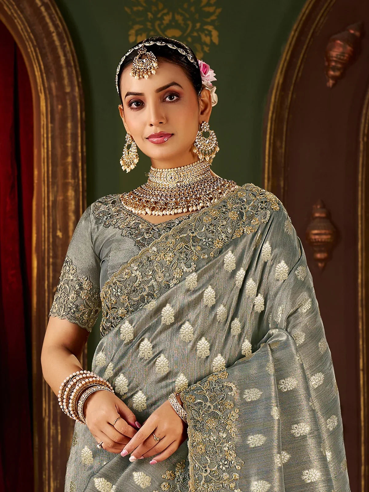 Tarani green saree close-up view showing rich zari work and floral blouse design