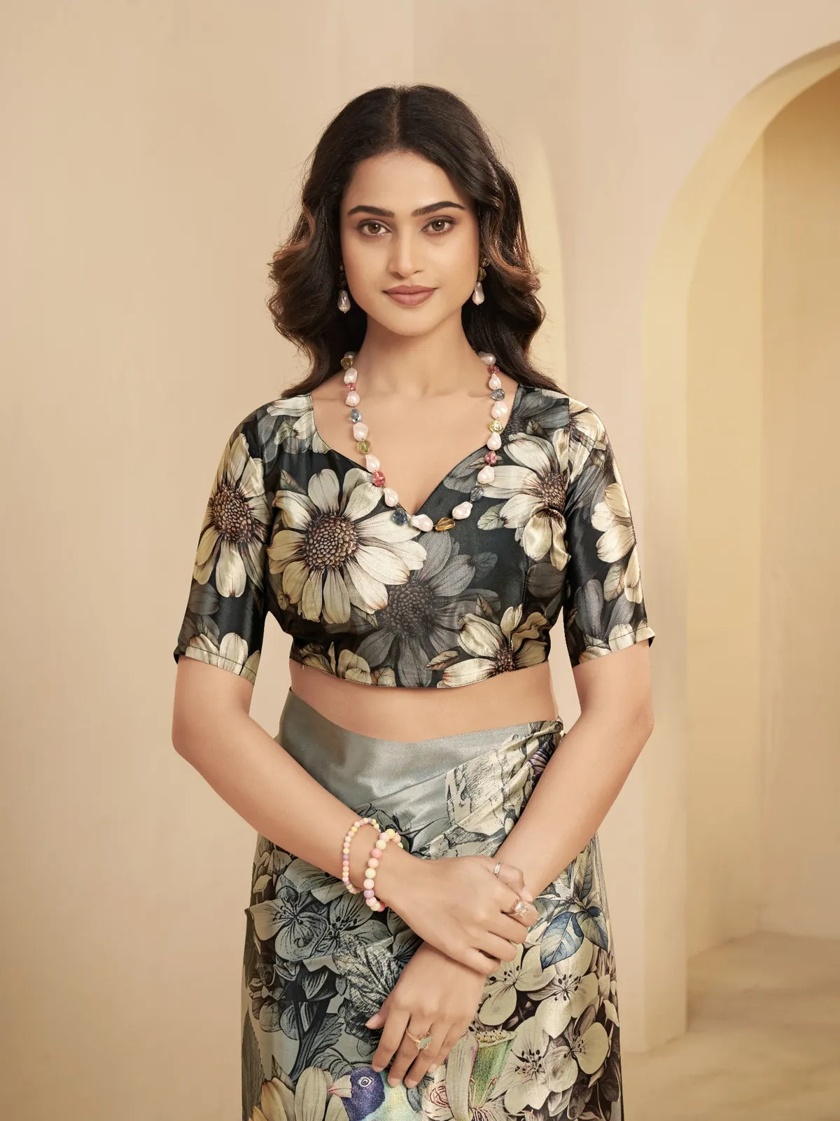 Tarani green saree with designer floral blouse in sunflower pattern and front neckline