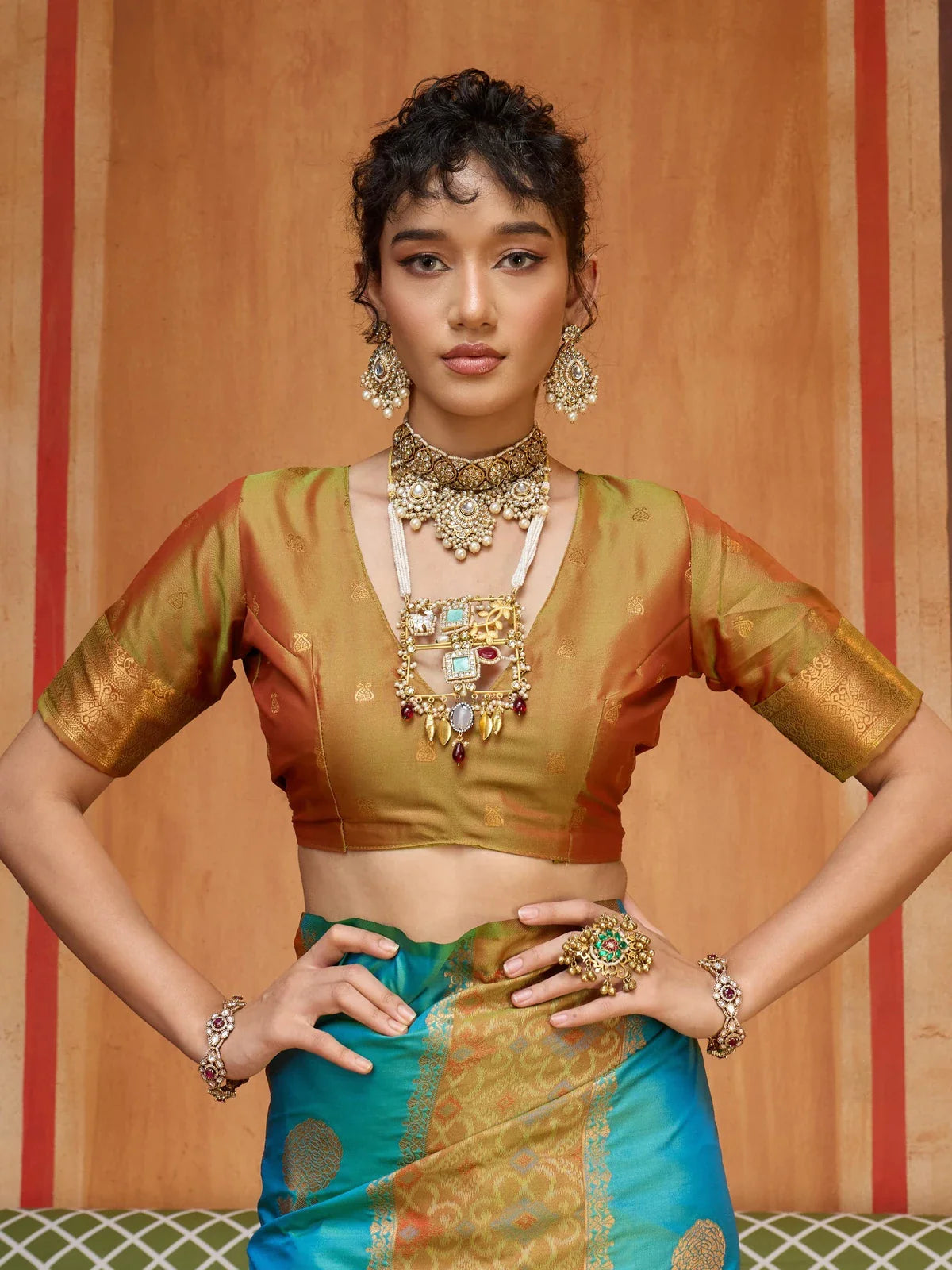 Tarani pure silk saree with golden woven blouse and layered neck jewellery upper body closeup